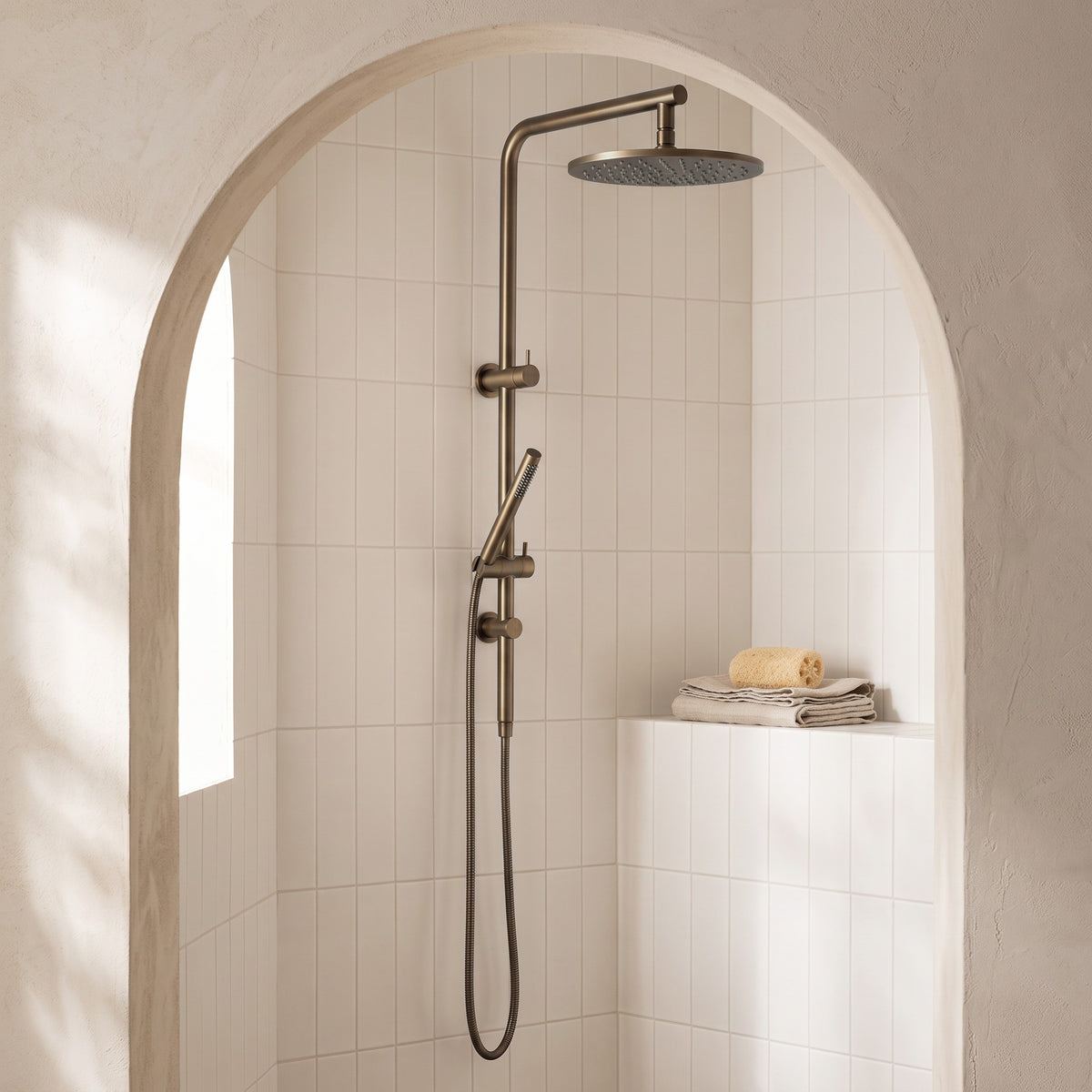 Corsica Dual Shower Head in Antique Brass in a shower