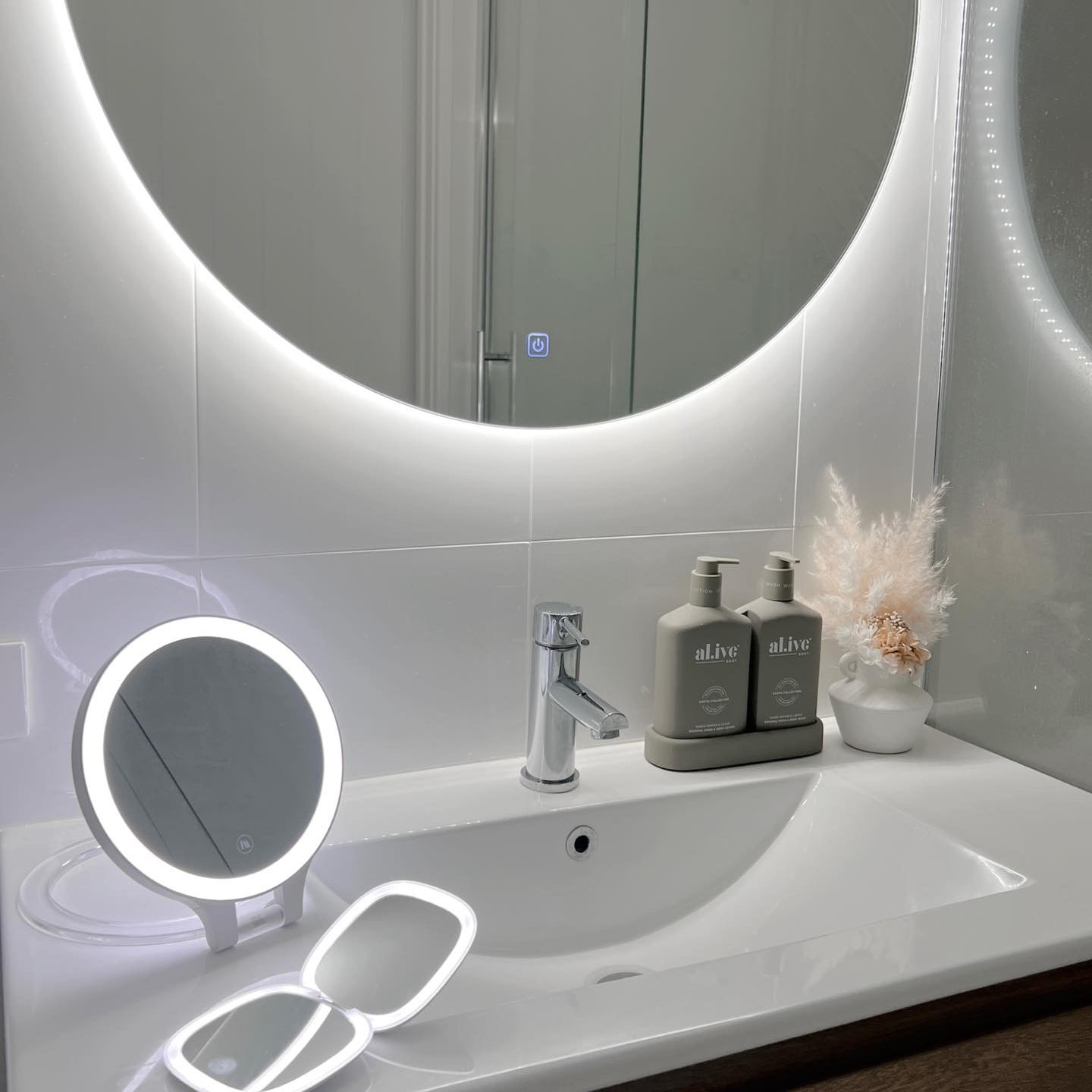 Circle Backlit Mirror on White Wall, LED Mini Make-Up Mirror, and Small Circle LED Mirror on Vanity