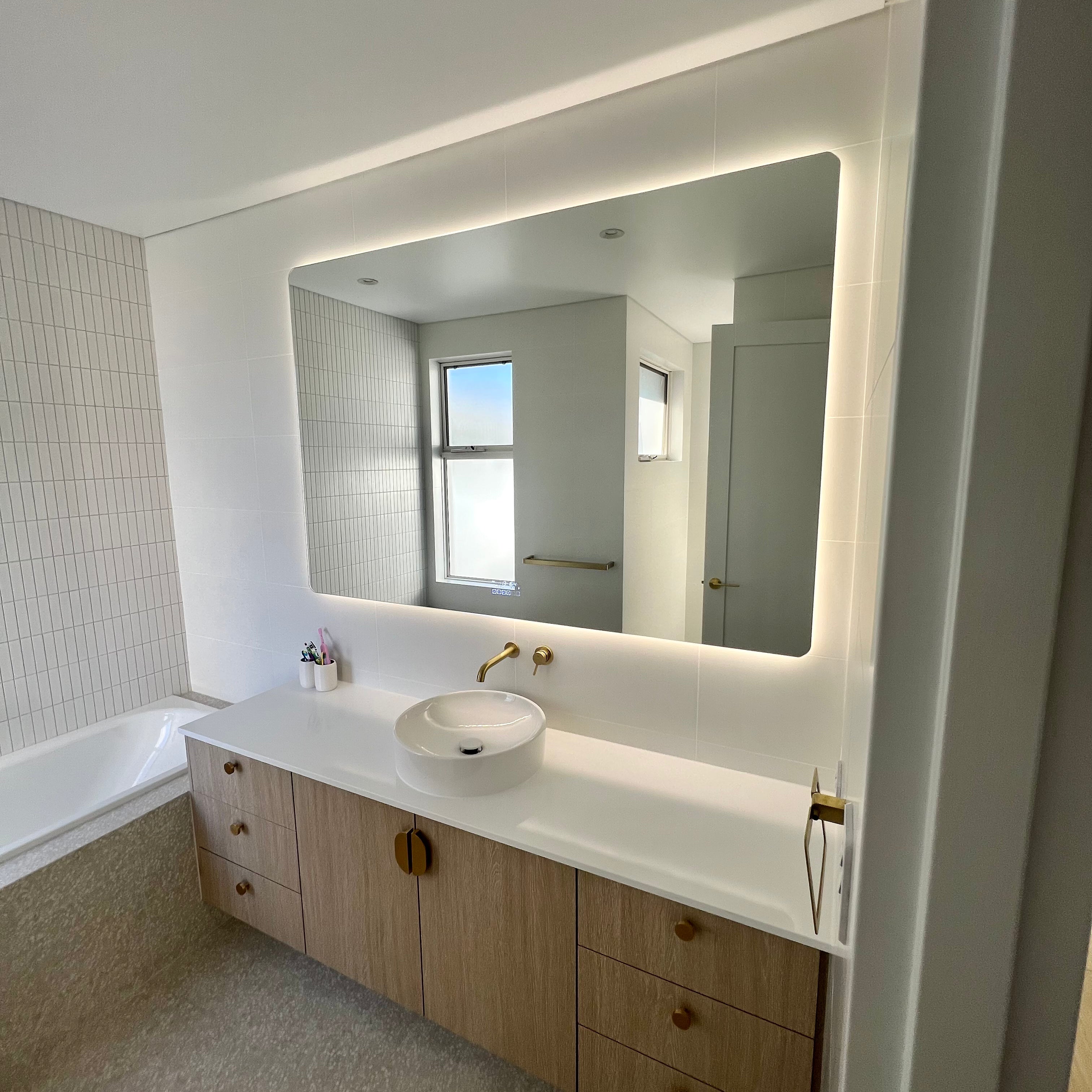Entrance View of Smart LED Mirror: Lighting White & Light Brown Themed Powder Room