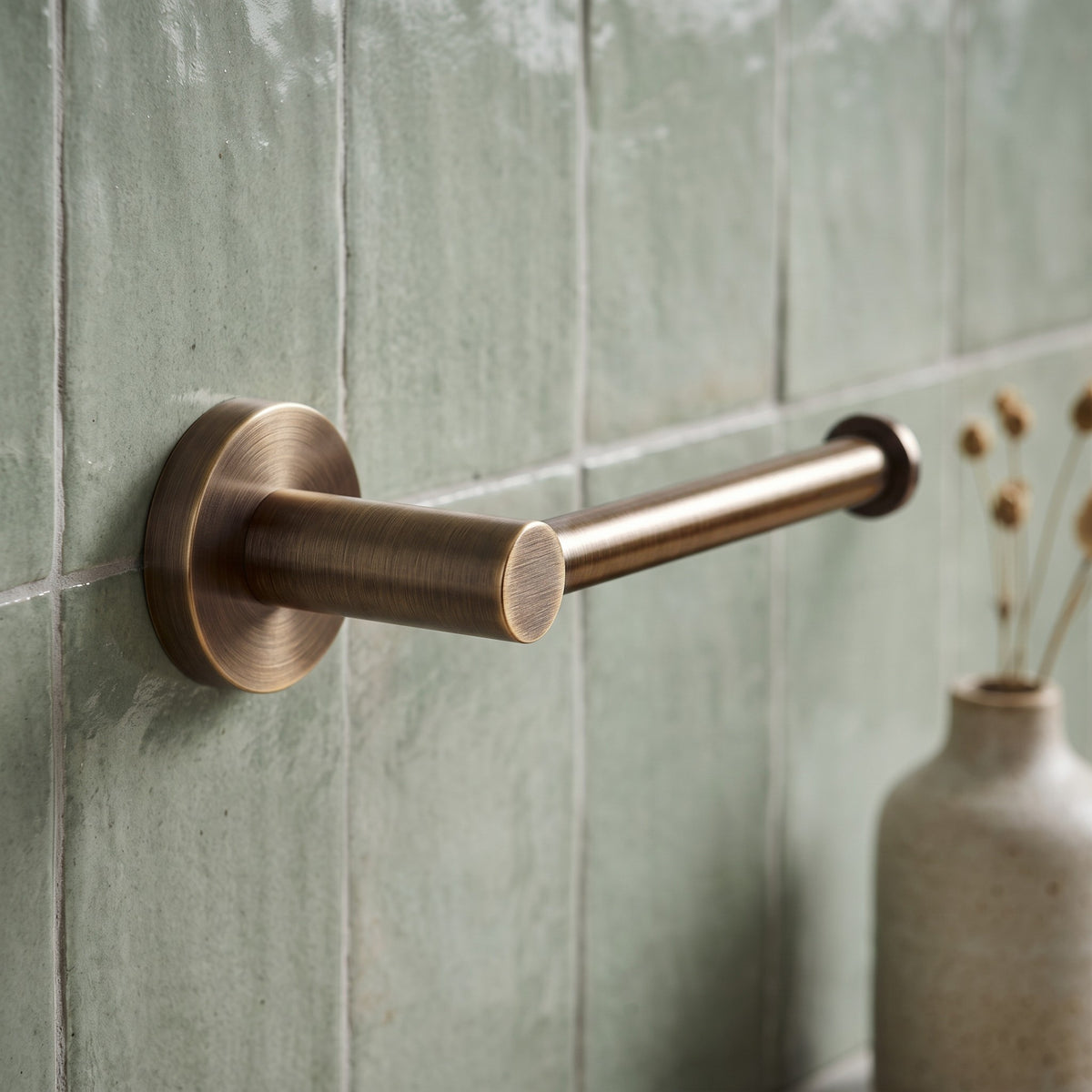 Close-up of the Lille Toilet Roll Holder in Antique Brass