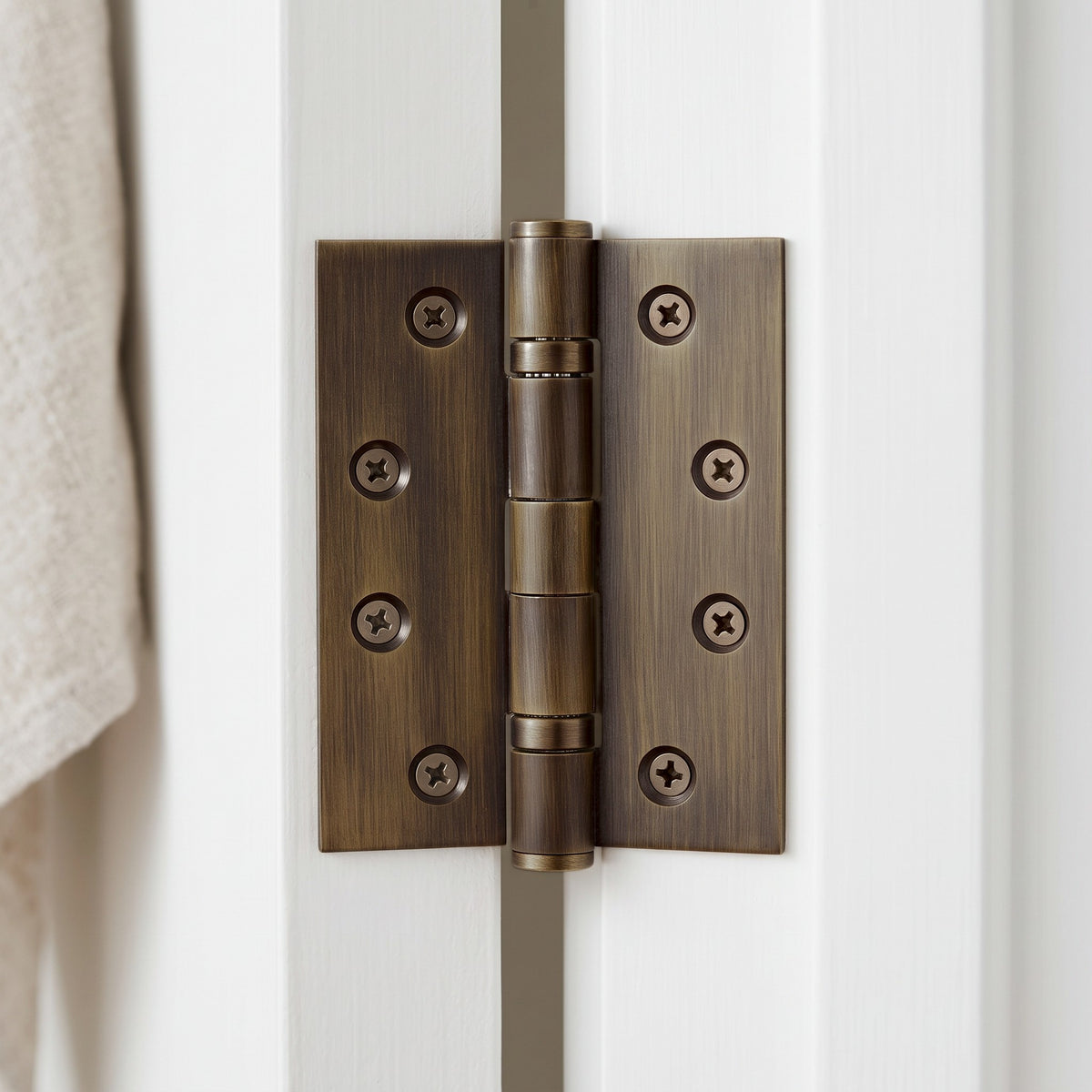 Venezia Door Butt Hinge in Antique Brass on an interior door