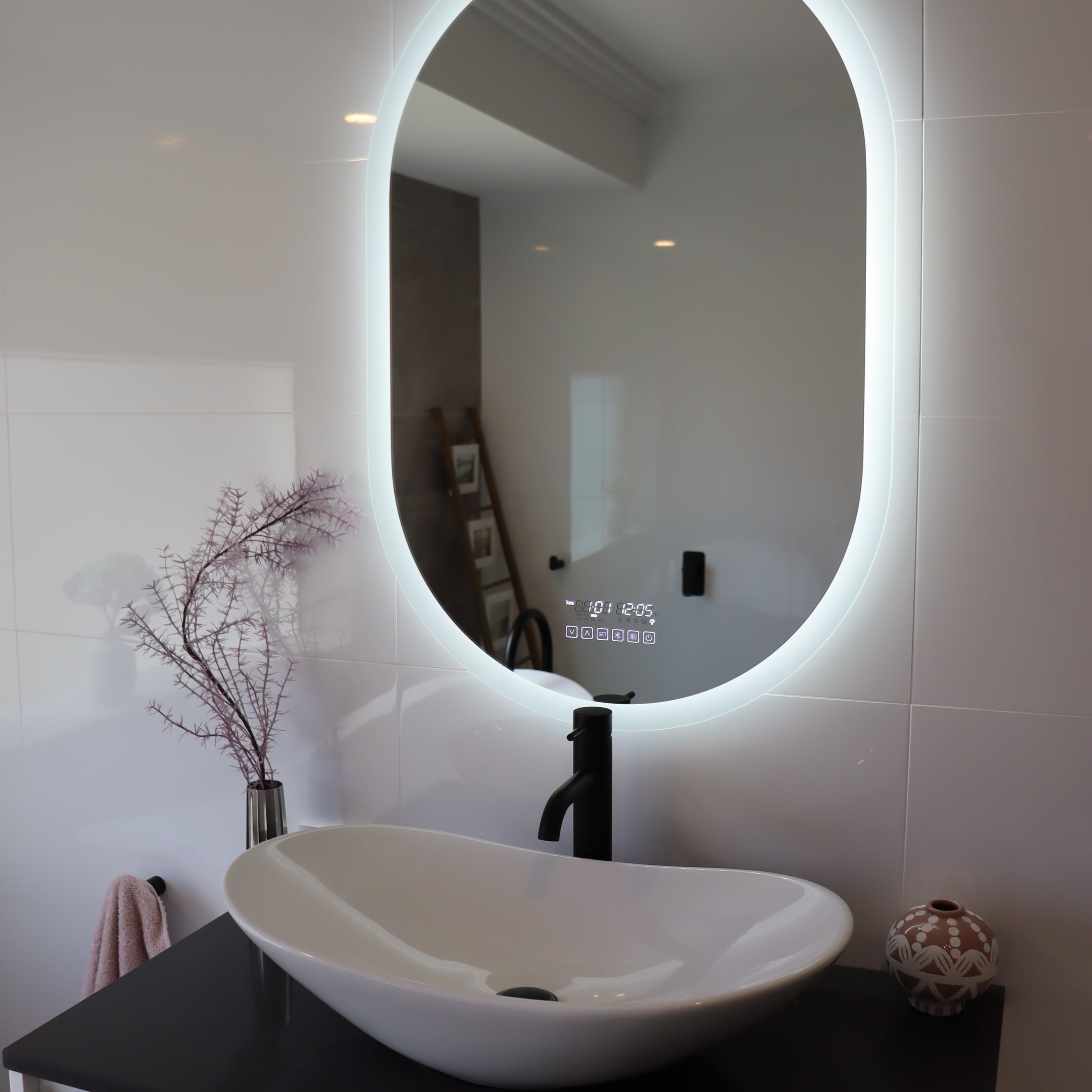 Oval Smart LED mirror illuminates the bathroom in the absence of main lights