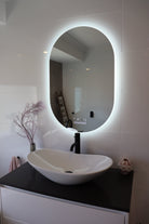 Oval Smart LED mirror illuminates the bathroom in the absence of main lights