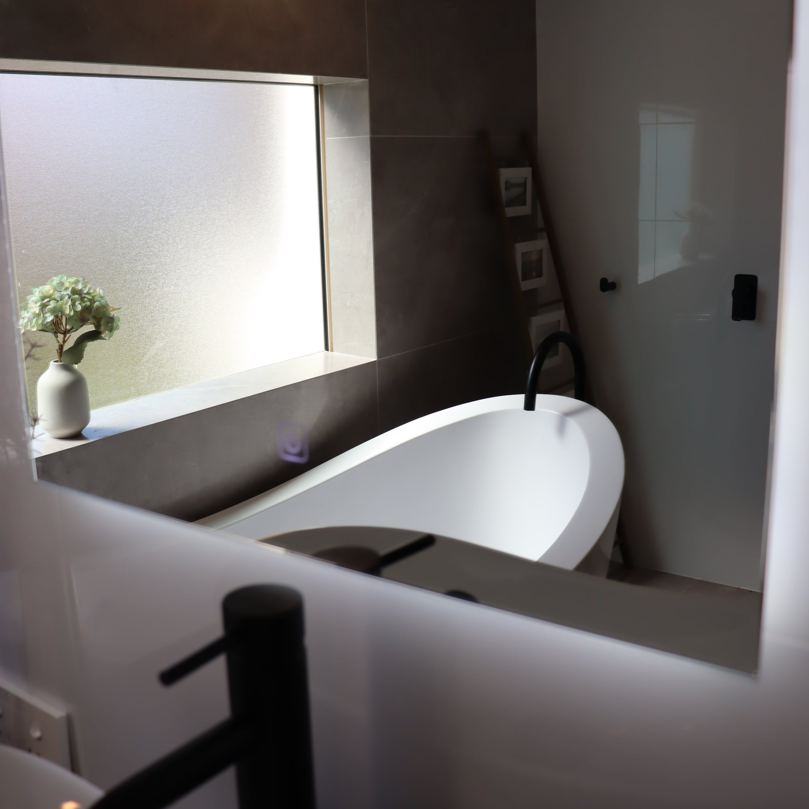 Soft Radiance from the Base of Lighted Arch-Shaped LED Mirror