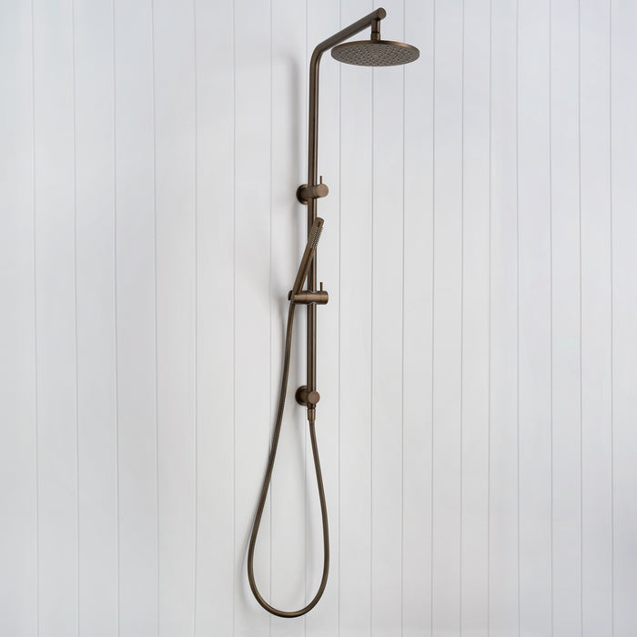 Corsica Dual Shower Head in Antique Brass, three-quarter view of the rail, rain head and looped handset hose