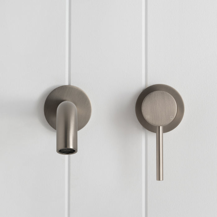 Milano Wall Spout Plus Wall Mixer in Brushed Nickel, front view of spout and lever mixer on white vertical-panelled wall