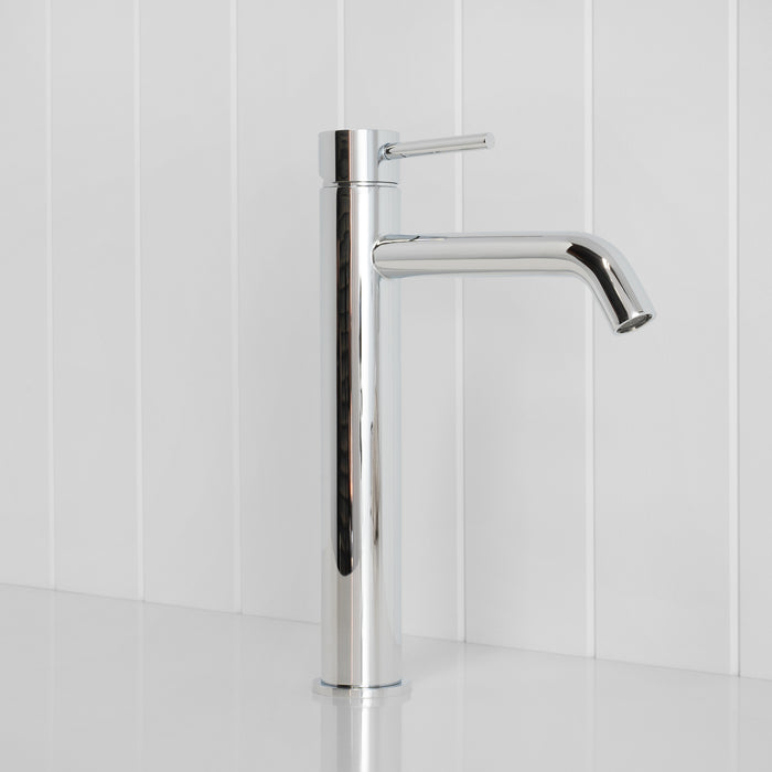 Vienna Tall Basin Mixer in Chrome, three-quarter view, spout to the right on a white vertical-panelled wall