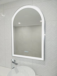 Stylish Arch-shaped Smart LED Mirror in pristine all-white bathroom