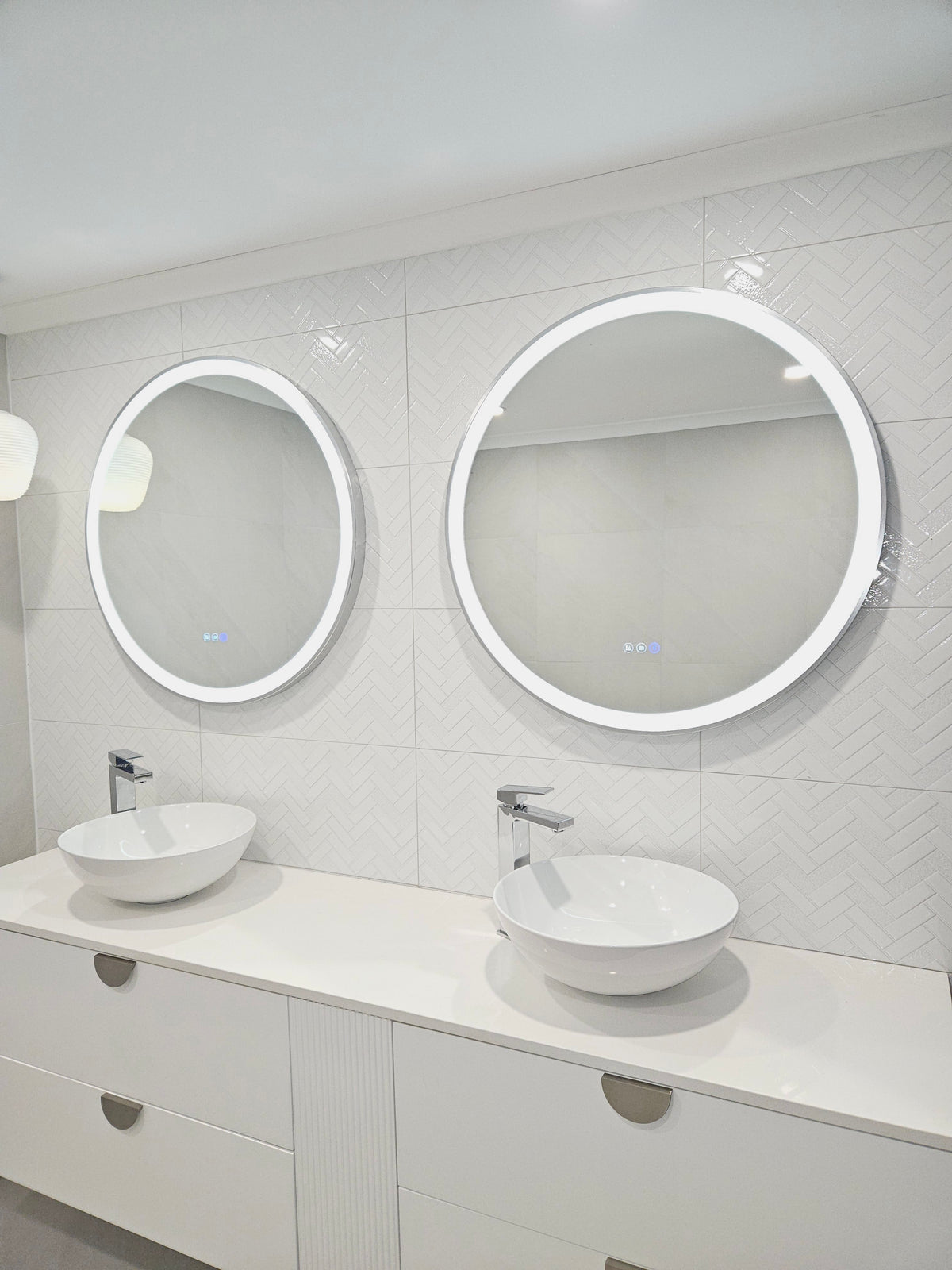 InVogue Mirrors' Silver Frame Circle Smart LED Mirrors Adding Style to All-White Bathroom