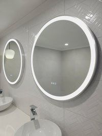 Side Low Perspective of Two InVogue Mirrors' Silver Framed Circle Smart LED Mirrors