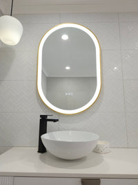 Pill-shaped Smart LED Mirror in Modern Elegance White Powder Room