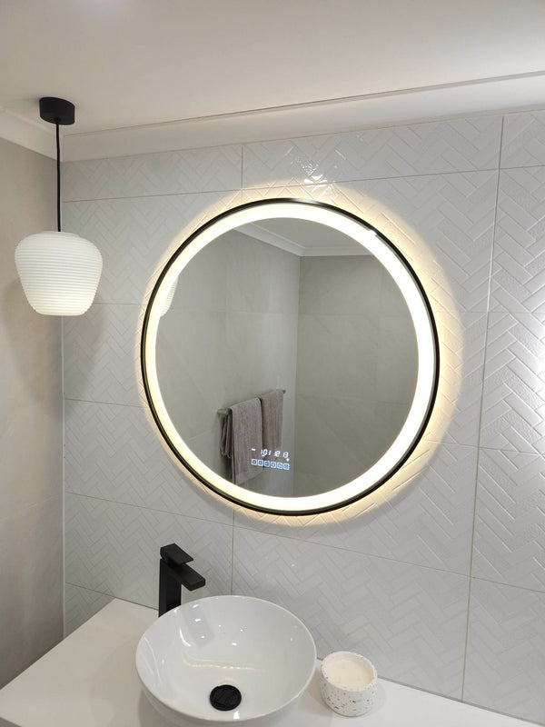 InVogue Mirrors' Circle Smart LED Mirror Lighting Up White Powder Room