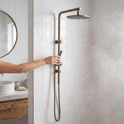 Corsica Dual Shower Head in Antique Brass in use in a shower