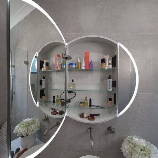 Round frameless LED bathroom mirror with glass shelves by Invogue