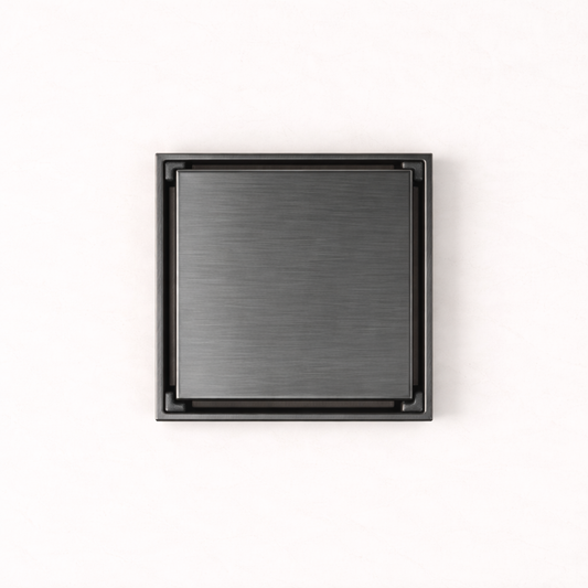 Granada Tile Insert Floor Waste in Brushed Gunmetal, top-down view of the square brushed cover on a plain white background