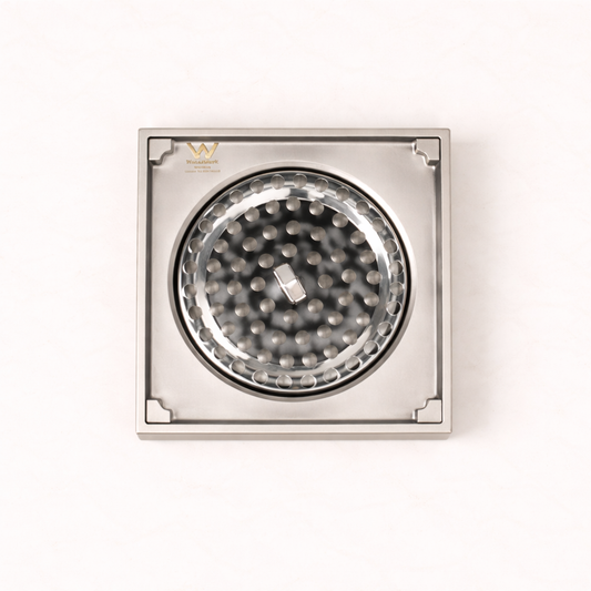 Granada Tile Insert Floor Waste in Brushed Nickel, cover removed to show the round strainer on a plain white background