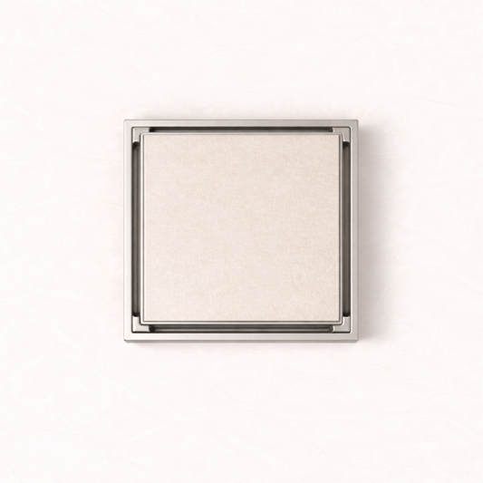 Granada Tile Insert Floor Waste in Brushed Nickel, top-down view, light stone tile in the cover on a plain white background