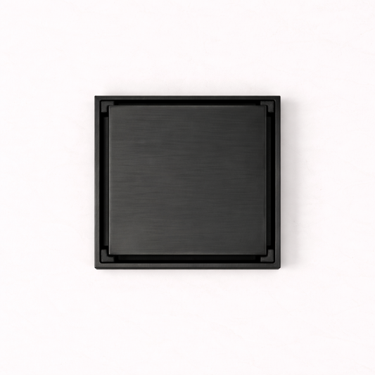 Granada Tile Insert Floor Waste in Matte Black, top-down view of the square brushed cover on a plain white background