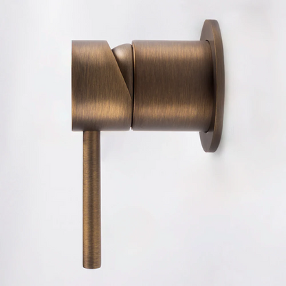 Milano Wall Mixer in Antique Brass, side profile showing the round body and lever on a plain white background