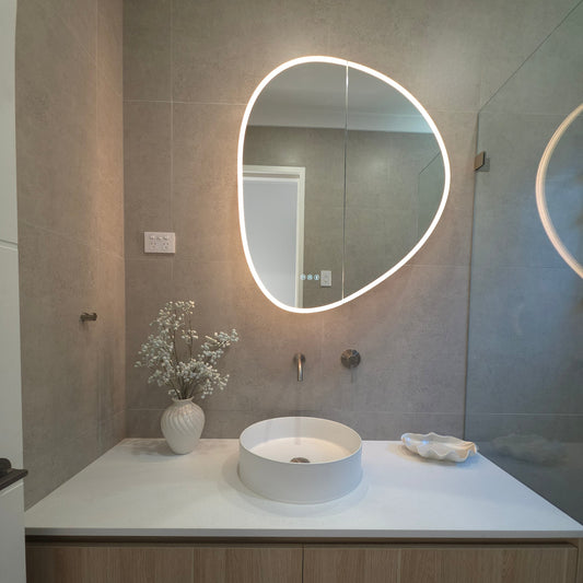 Frameless LED mirror cabinet organic shape with internal storage and lighting