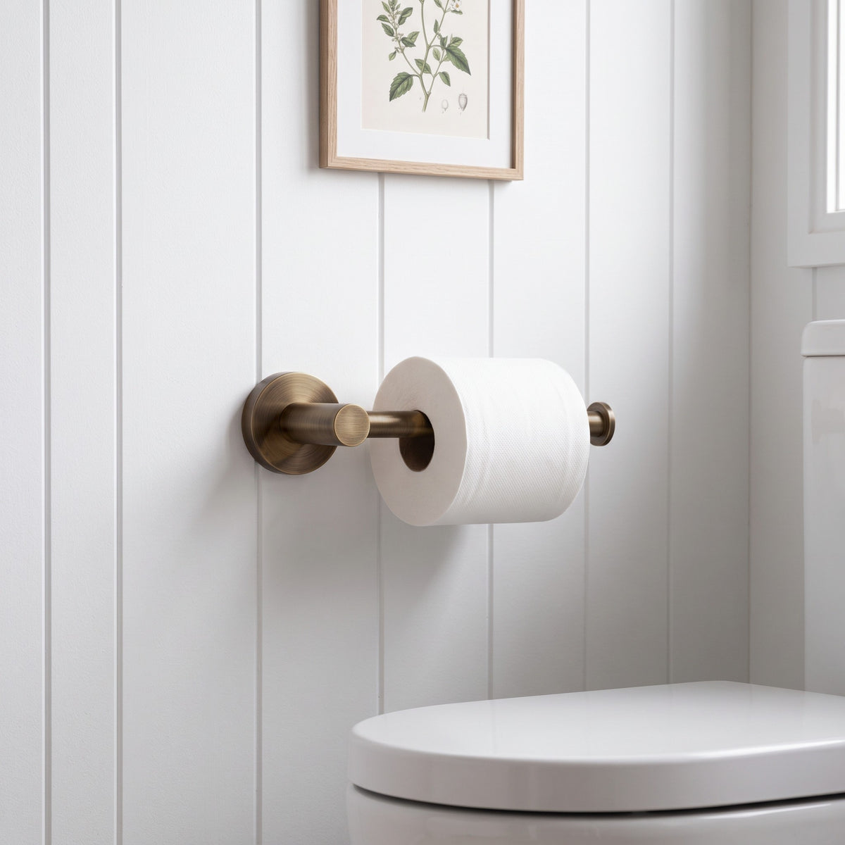 Lille Toilet Roll Holder in Antique Brass in a bathroom