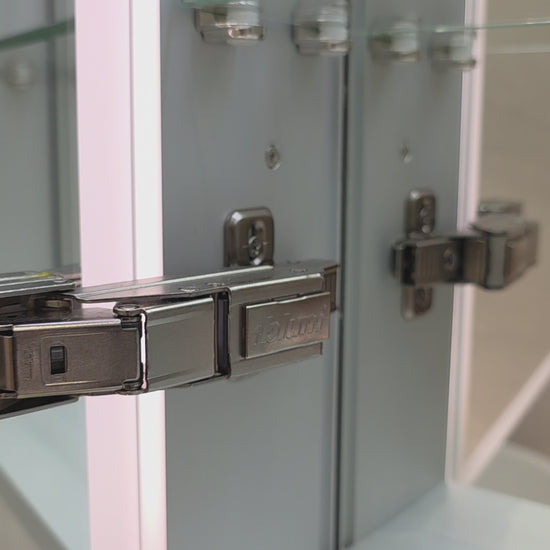Frameless LED mirror cabinet showing internal storage and lighting by Invogue