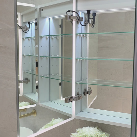 Video demonstration of frameless LED bathroom mirror cabinet showing internal storage and adjustable glass shelves