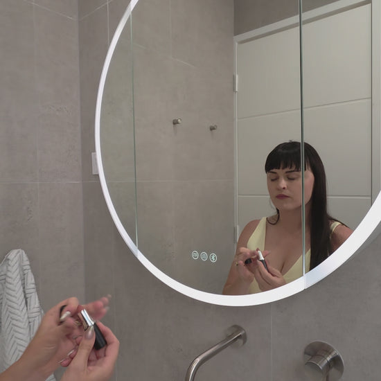 Video demonstration of frameless LED bathroom mirror cabinet showing internal storage and lighting