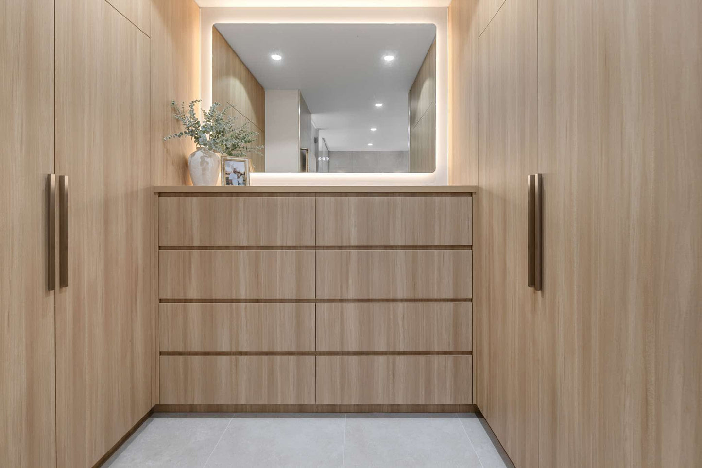 Florence LED mirror above a timber vanity flanked by full-height timber cabinetry