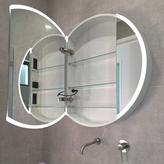 Round frameless LED bathroom mirror with bluetooth speakers by Invogue