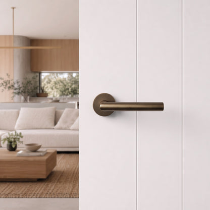 Santorini Door Handle in Antique Brass on an interior door