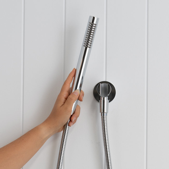 Versailles Handheld Shower Head with Hose in Chrome, hand holding the slim handpiece beside the round wall bracket