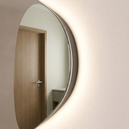 The Sorrento frameless backlit LED mirror, 800 x 550mm, side detail of the slim glass edge with warm light from behind