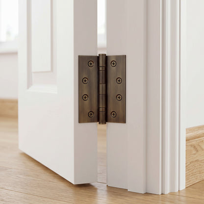 Venezia Door Butt Hinge in Antique Brass on an interior door