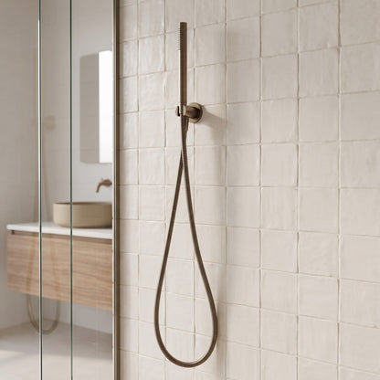 Versailles Handheld Shower Head with Hose in Antique Brass in a shower