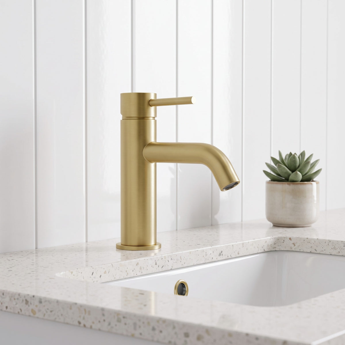 Vienna Short Basin Mixer in Brushed Brass in a bathroom
