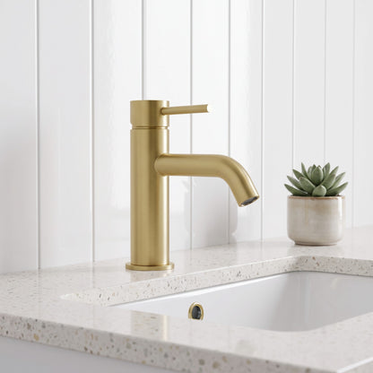 Vienna Short Basin Mixer in Brushed Brass in a bathroom