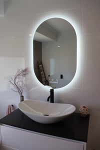 Oval Smart LED mirror illuminates the bathroom in the absence of main lights