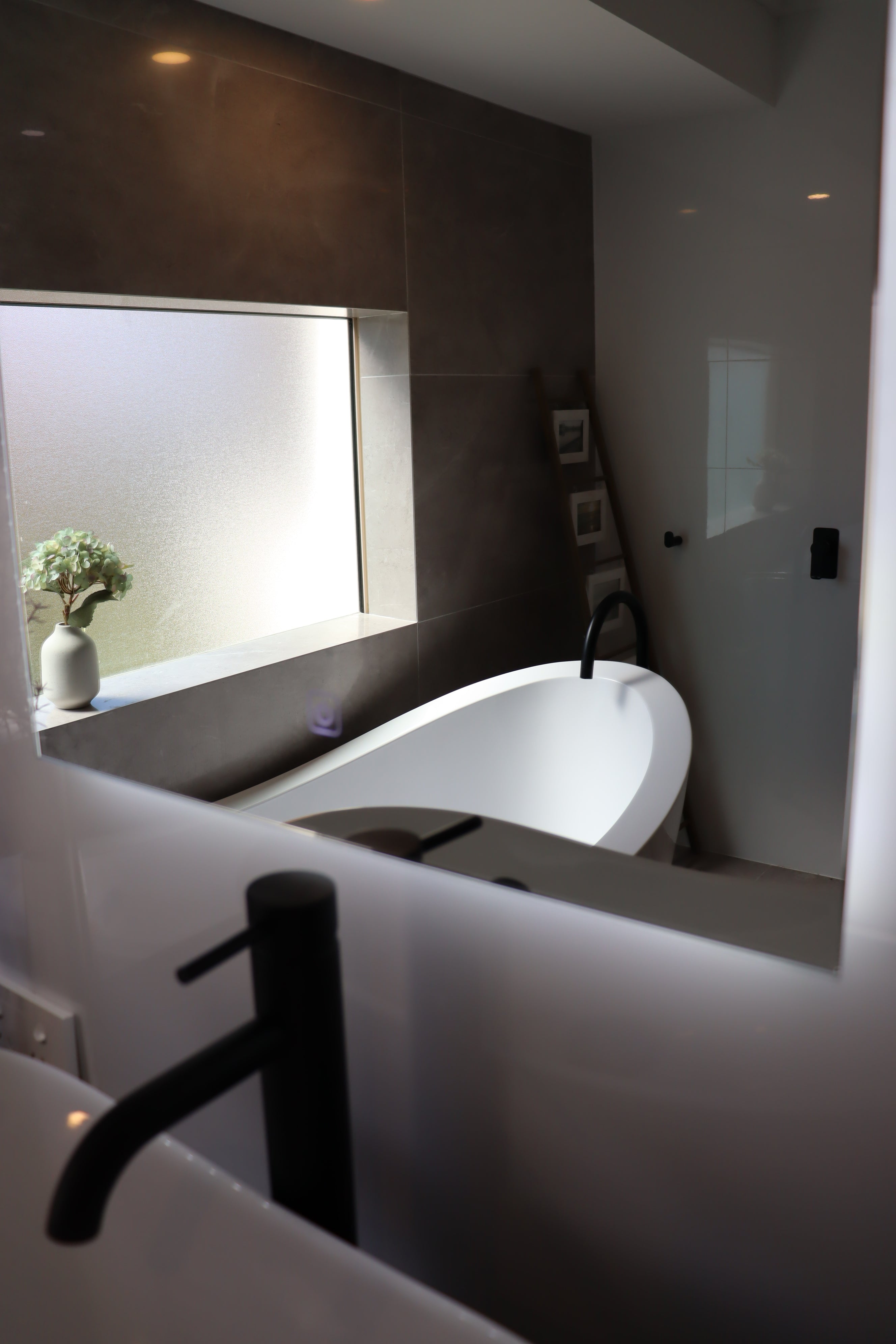 Soft Radiance from the Base of Lighted Arch-Shaped LED Mirror