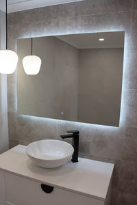 Vanity area in a dirty grey and white themed bathroom