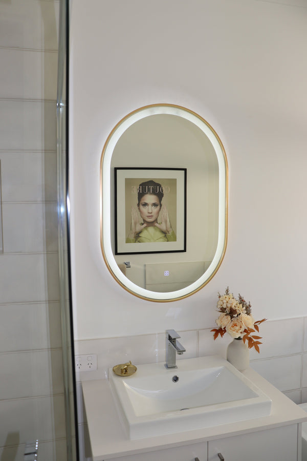 Sleek Silver Frame LED Vanity Mirror Capturing Opposite Wall's Artwork